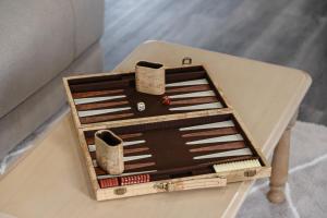 a wooden box with chopsticks sitting on a table at Native Retreat - Tranquil Seaham Escape in Seaham +9 photos