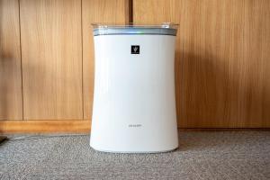 a white cooler sitting on the floor next to a wall at c Furano A in Furano +23 photos