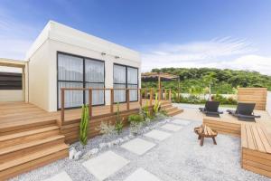a rendering of a house with a deck at KAYATSUMA OKINAWA Hotel&Resort in Nakijin