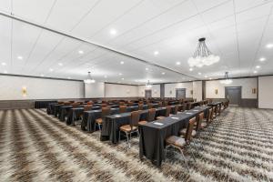 a large room with rows of tables and chairs at DoubleTree by Hilton Hotel Wilmington in Wilmington