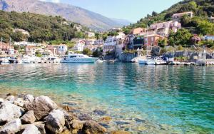 a group of boats in a body of water with houses at La casa di Carmela e Francesco b&b in Massa