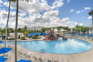 a pool at a resort with a slide at Hilton Vacation Club Cypress Pointe Orlando in Orlando