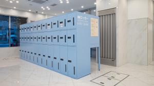 a row of lockers sitting in a room at Toyoko Inn Kure-eki in Kure