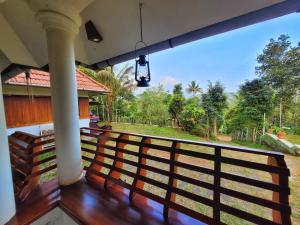 a view from the balcony of a house at Traditional Villa Munnar in Anachal