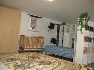 a bedroom with a bed and a book shelf at Appartamento open space al civico 29 in Collestrada