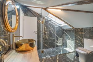 a bathroom with a tub and a shower at Agis Luxury House in Lefkada +23 photos