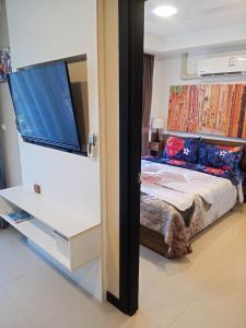 a bedroom with a bed and a large window at Vacation by the ocean in Phuket +18 photos