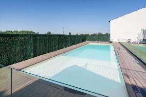 a swimming pool on the roof of a building at Camino Blanco in Ibeas de Juarros