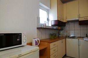 Kuchyň nebo kuchyňský kout v ubytování Guest House Heart of Budva