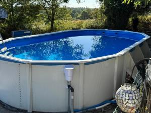 a large jacuzzi tub in a backyard at Gîtes Bourdeverre in Sanxay