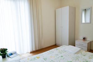 Postel nebo postele na pokoji v ubytování Guest House Heart of Budva