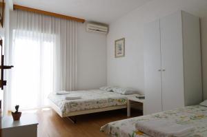 Postel nebo postele na pokoji v ubytování Guest House Heart of Budva