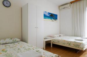 Postel nebo postele na pokoji v ubytování Guest House Heart of Budva