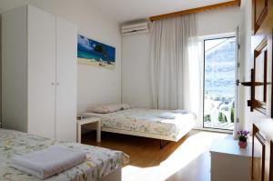 Postel nebo postele na pokoji v ubytování Guest House Heart of Budva