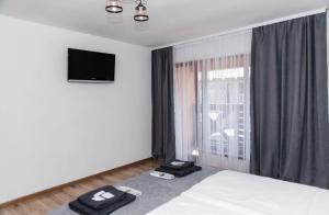 a hotel room with a bed and a window at Anamyra in Mizhhirya