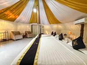 a large bed in the middle of a tent at Chevilly Resort & Camp in Bogor +209 photos