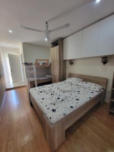 a bedroom with a large bed in a room at AG Hotel in Dhërmi +10 photos