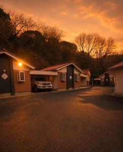 a group of houses with a car parked in a driveway at ホテルwith宮崎 in Miyazaki