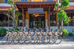 a row of bikes parked in front of a building at Royal Riverside Hoi An Hotel-Newly Renovated & Reopened in Hoi An