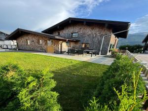 a brick building with a picnic table in front of it at Chalet near Passthurn Ski Area Kitzbühel in Mittersill