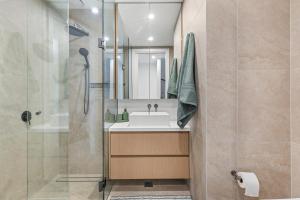 a bathroom with a sink and a shower at Brighton Beach Terrace in Melbourne +3 photos