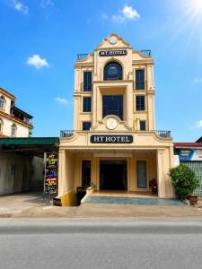 a building with a sign on the front of it at HT Hotel Hà Tĩnh in Hà Tĩnh