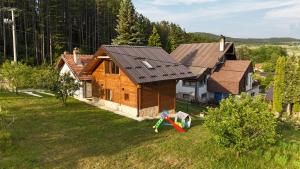 an overhead view of a house with a kite in the yard at Kraljica Radoinja in Kokin Brod