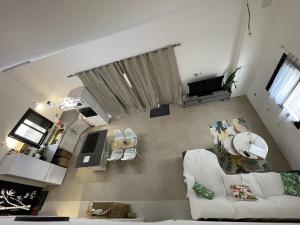 an overhead view of a living room with a couch at La Kazbanon in La Possession