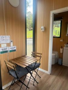 a wooden bench in a room with a toilet at Gum Tree by Tiny Away in Dixons Creek