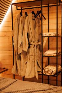 a towel hanging on a rack in a bedroom at Давидів Хутір in Zhytomyr