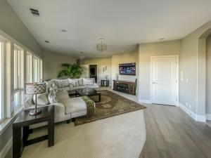 a living room with a couch and a table at Serrano Village Villa in El Dorado Hills
