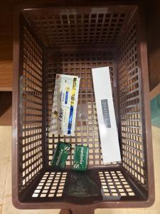 a shopping cart filled with toothpaste and toothpaste at WKND Casa in Panchgani
