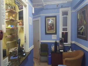 a blue room with a desk and a chair at Desmond Hotel in San Francisco +69 photos
