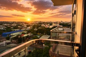 a view of a city at sunset from a building at Thảo Ngân Pleiku Hotel in Pleiku