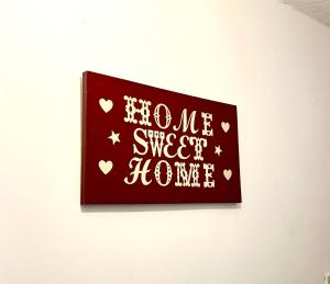 a sign on a wall that reads home super sweet home at Cosy room in Wolverhampton perfect for contractors in Wolverhampton +5 photos