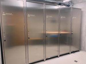a row of metal lockers in a room at Casa Rok in Flims