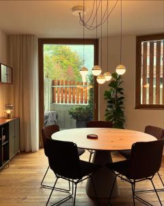 a dining room with a table and chairs at Casa Rok in Flims