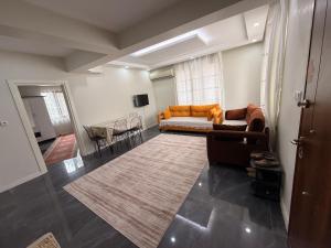 a living room with a couch and a rug at Deluxe apart in Pamukkale
