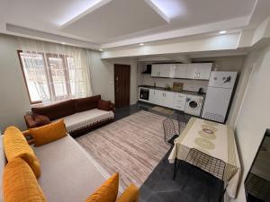 a living room with a couch and a table at Deluxe apart in Pamukkale