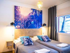 Postel nebo postele na pokoji v ubytování Haapala Suites entinen IIDA Vuokatti