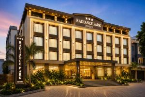 a building with a hotel sign in front of it at Hotel Radiance Park Delhi Airport in New Delhi