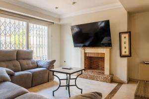 a living room with a couch and a fireplace at Beachfront chalet in Valencia in Valencia