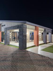 a rendering of a building at night at Lukholo guest house siyabuswa in Siyabuswa