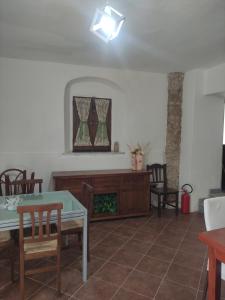 a living room with a table and chairs at Affittacamere Isidoro in Zaccanopoli +12 photos