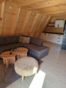 a living room with a couch and a table at Etno Selo Relax in Šipovo