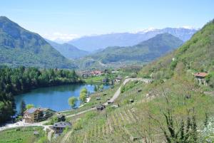 a view of a river with mountains in the background at Residence Hotel Miralago in Pergine Valsugana +154 photos