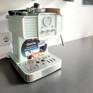 a toy coffee maker is sitting on a counter at Get-your-flat - Wohnen im Eulenturm tiny owl-house - naturnah & einzigartig - 60 m2 - Haustier auf Anfrage OG1 in Hagen