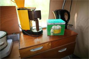 a counter with a blender and a box of eggs on it at KULT TRABANT "Villa Sachsenruh" direkt am Strand in Dranske