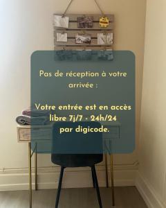 a desk with a chair and a sign on it at Escales patrimoniales en cœur de ville in Poitiers