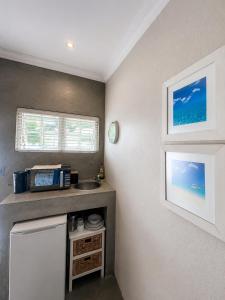 a small kitchen with a counter and a sink at Limonite Guesthouse in Pretoria